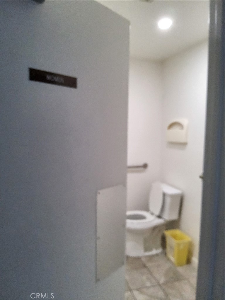 435 West 9th, Unit B3 Upland, CA 91786 - Photo 62 of 71 a white toilet sitting next to a bathroom sink