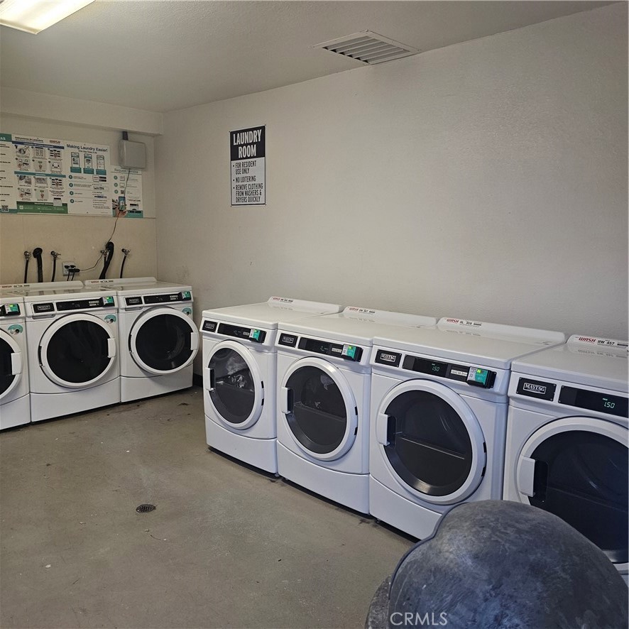 435 West 9th, Unit B3 Upland, CA 91786 - Photo 66 of 71 a utility room with dryer and washer