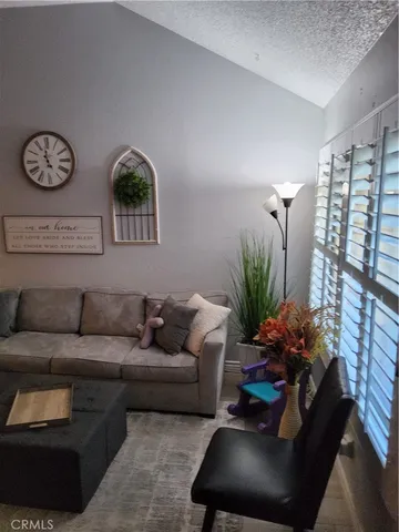 a kitchen with granite countertop a sink and a stove