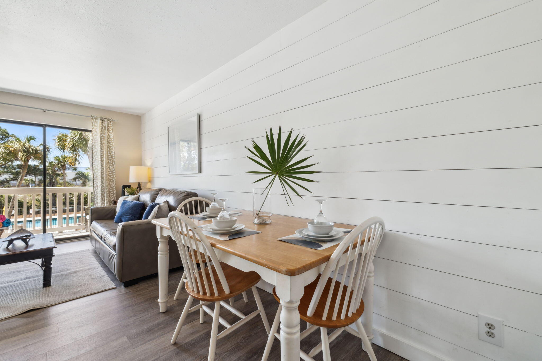 145 Beachfront Trail, Unit 102A Santa Rosa Beach, FL 32459 - Photo 17 of 33 a view of a dining room with furniture and wooden floor