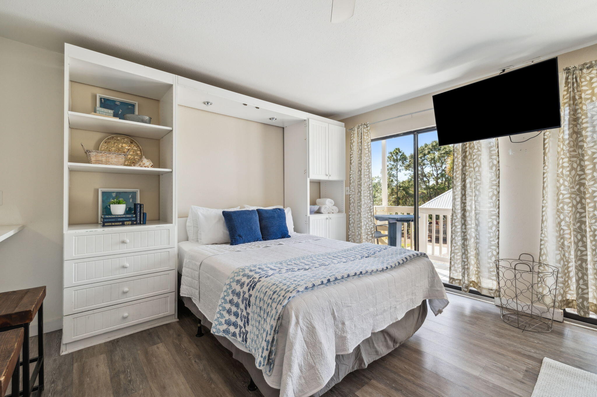 145 Beachfront Trail, Unit 102A Santa Rosa Beach, FL 32459 - Photo 19 of 33 a bedroom with a bed and a flat tv screen on the dresser
