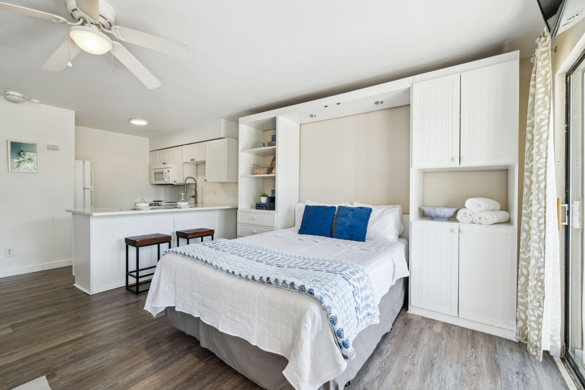 145 Beachfront Trail, Unit 102A Santa Rosa Beach, FL 32459 - Photo 20 of 33 a bedroom with a bed and a chandelier