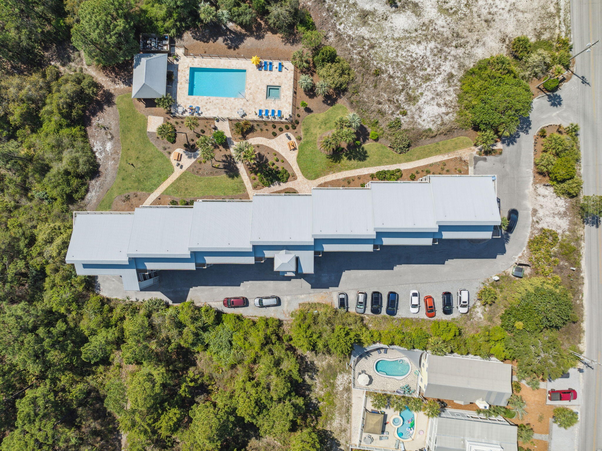145 Beachfront Trail, Unit 102A Santa Rosa Beach, FL 32459 - Photo 2 of 33 an aerial view of a house with garden space and street view
