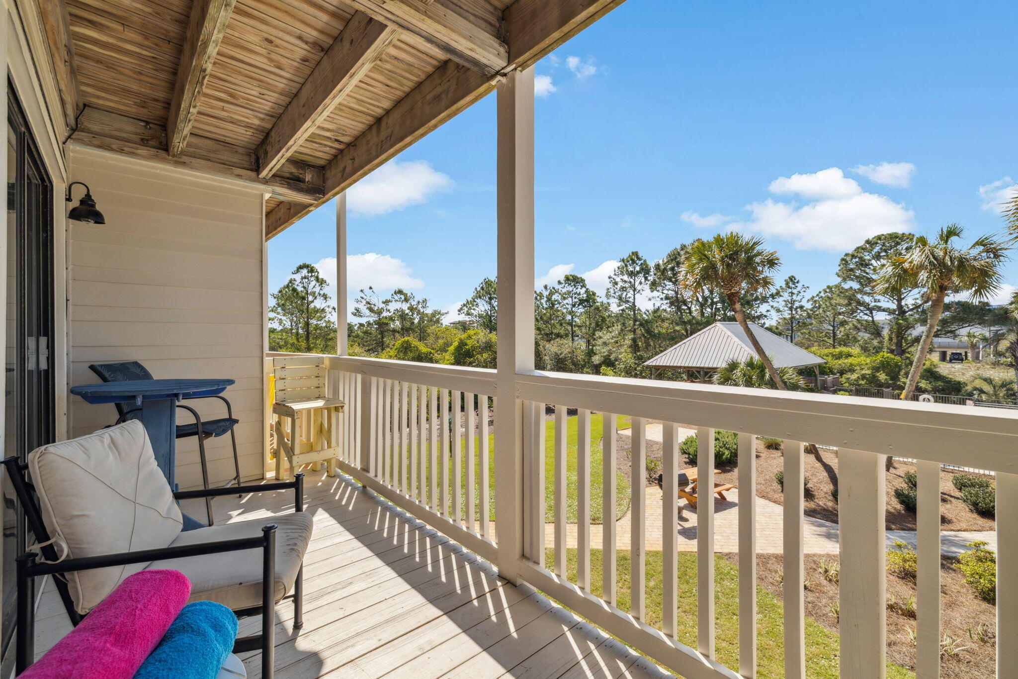 145 Beachfront Trail, Unit 102A Santa Rosa Beach, FL 32459 - Photo 24 of 33 a view of a chair in wooden deck