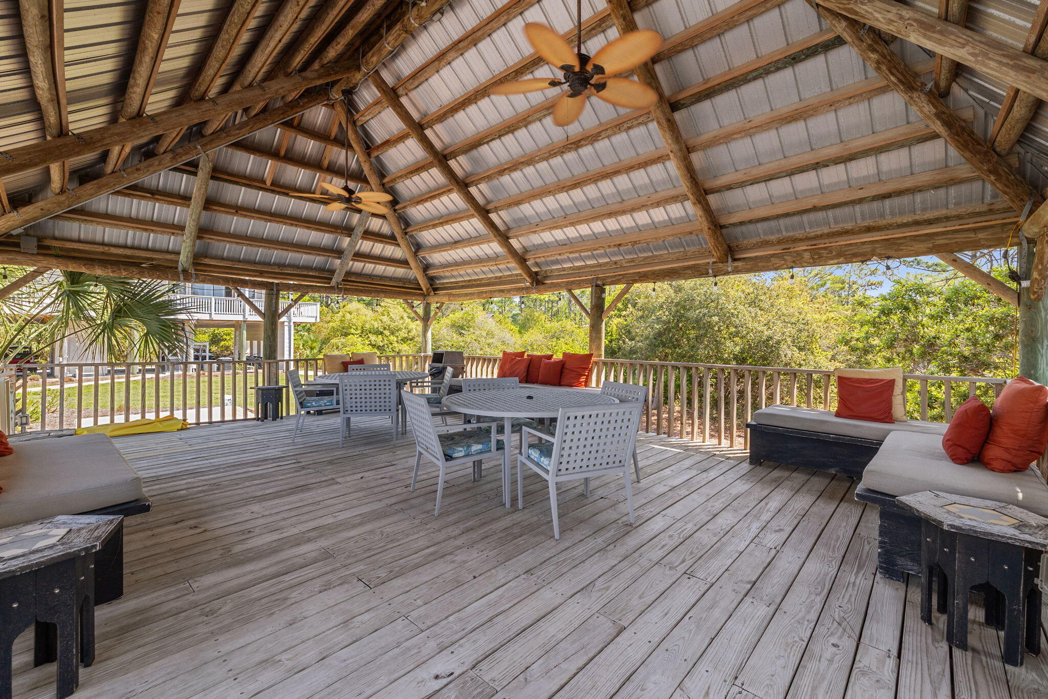 145 Beachfront Trail, Unit 102A Santa Rosa Beach, FL 32459 - Photo 26 of 33 a view of a patio with table and chairs and wooden floor
