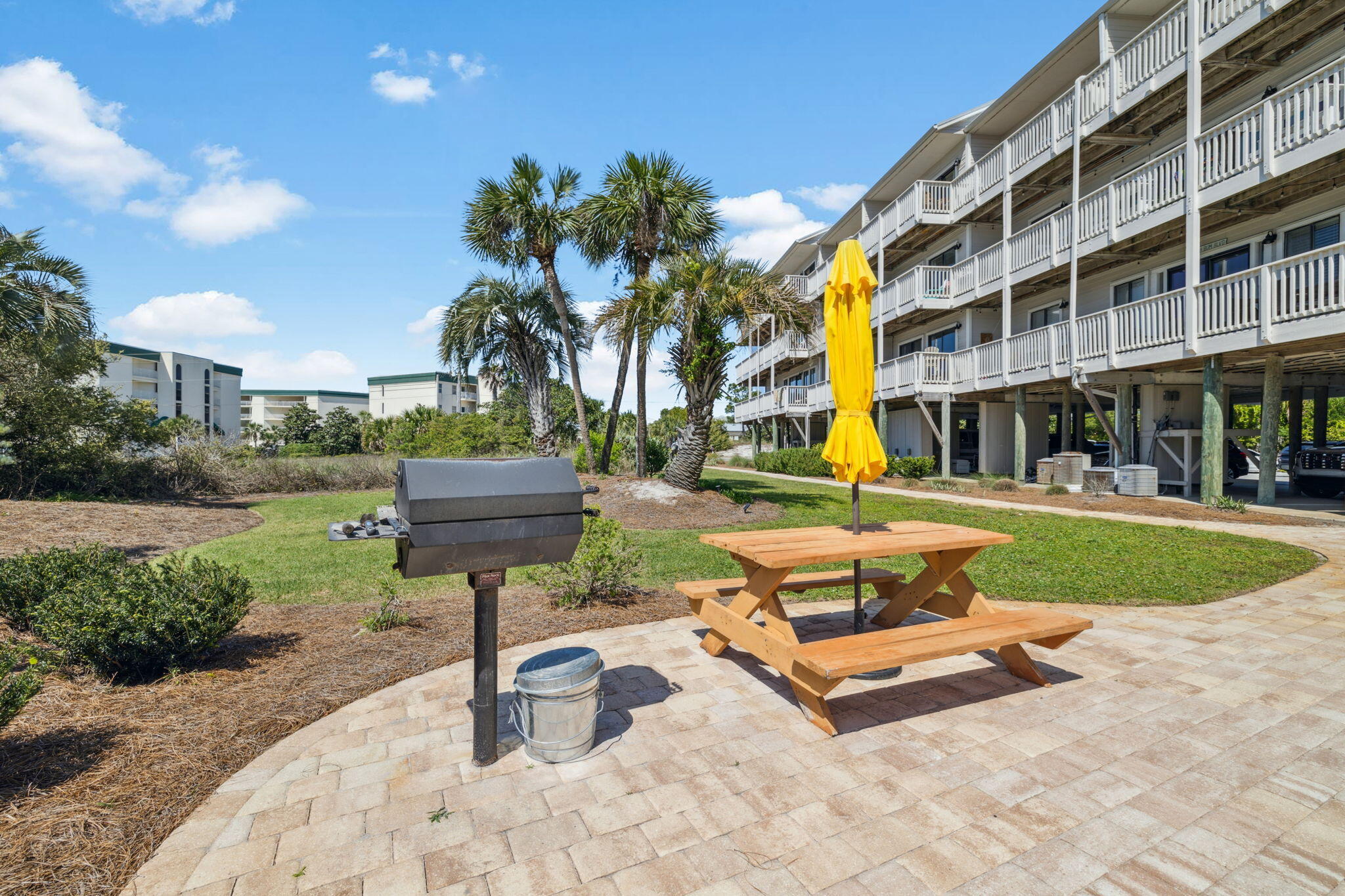 145 Beachfront Trail, Unit 102A Santa Rosa Beach, FL 32459 - Photo 27 of 33 a swimming pool with outdoor seating and yard