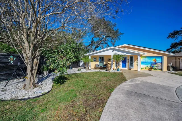 a view of a house with a yard porch and sitting area