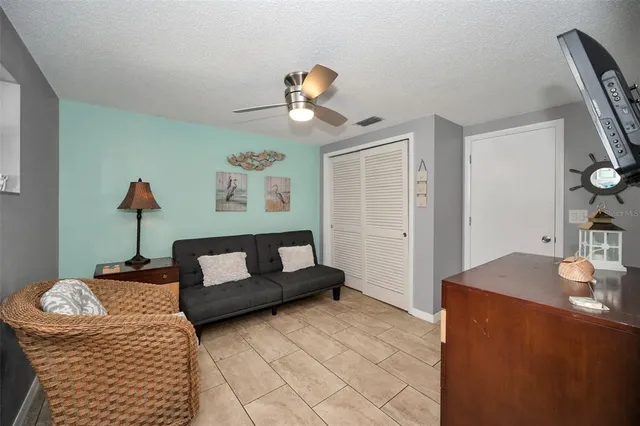 a bathroom with a tub shower and windows