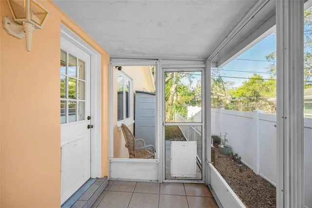 a dining room with furniture window and wooden floor