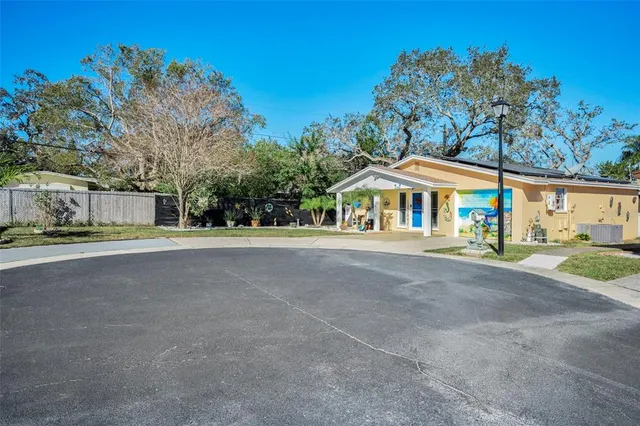 a kitchen with sink and cabinets