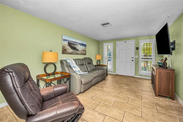 a kitchen with granite countertop stainless steel appliances and wooden cabinets