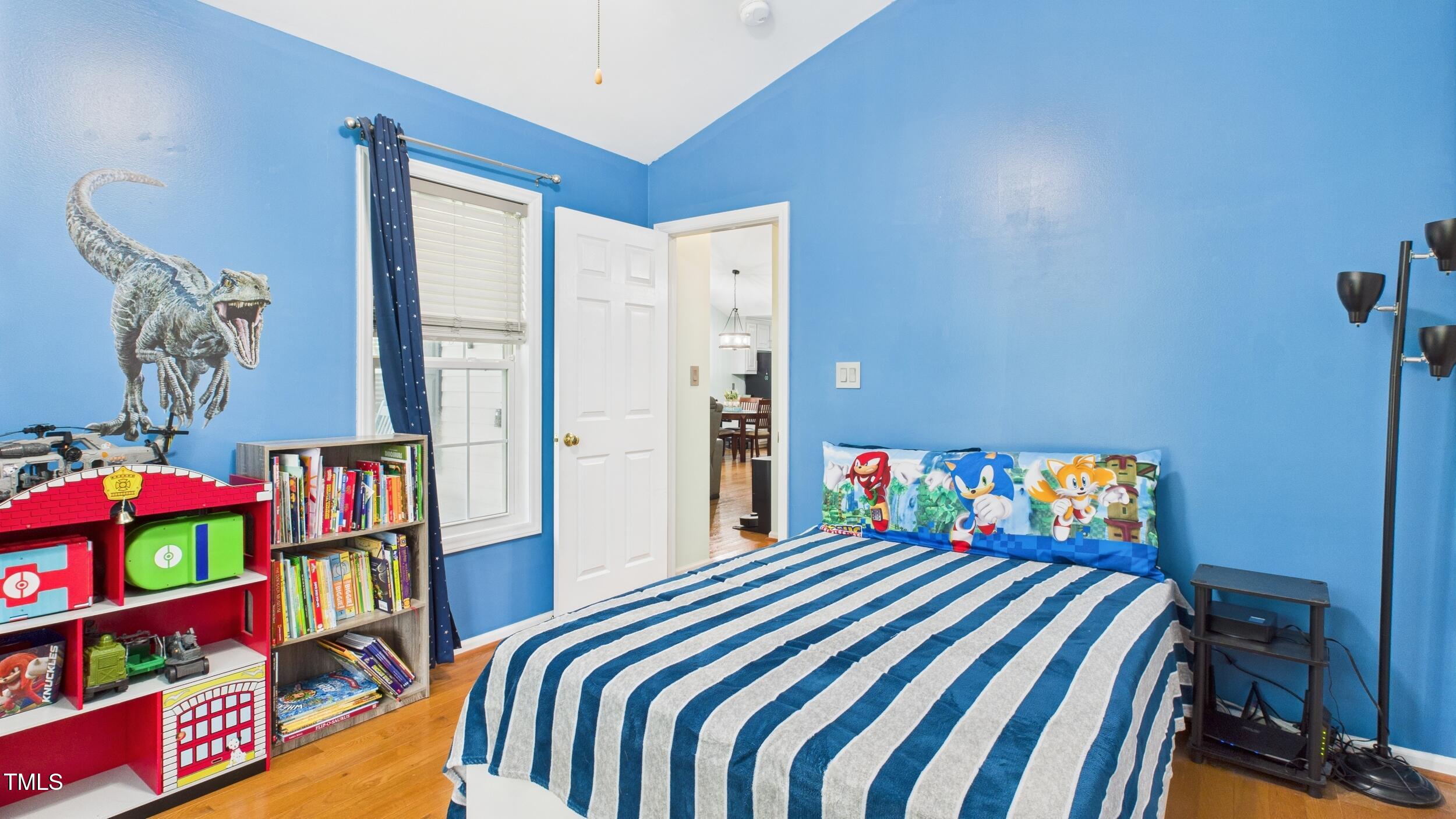 5309 Meadow Field Drive Mebane, NC 27302 - Photo 15 of 41 a bedroom with a bed and a book shelf