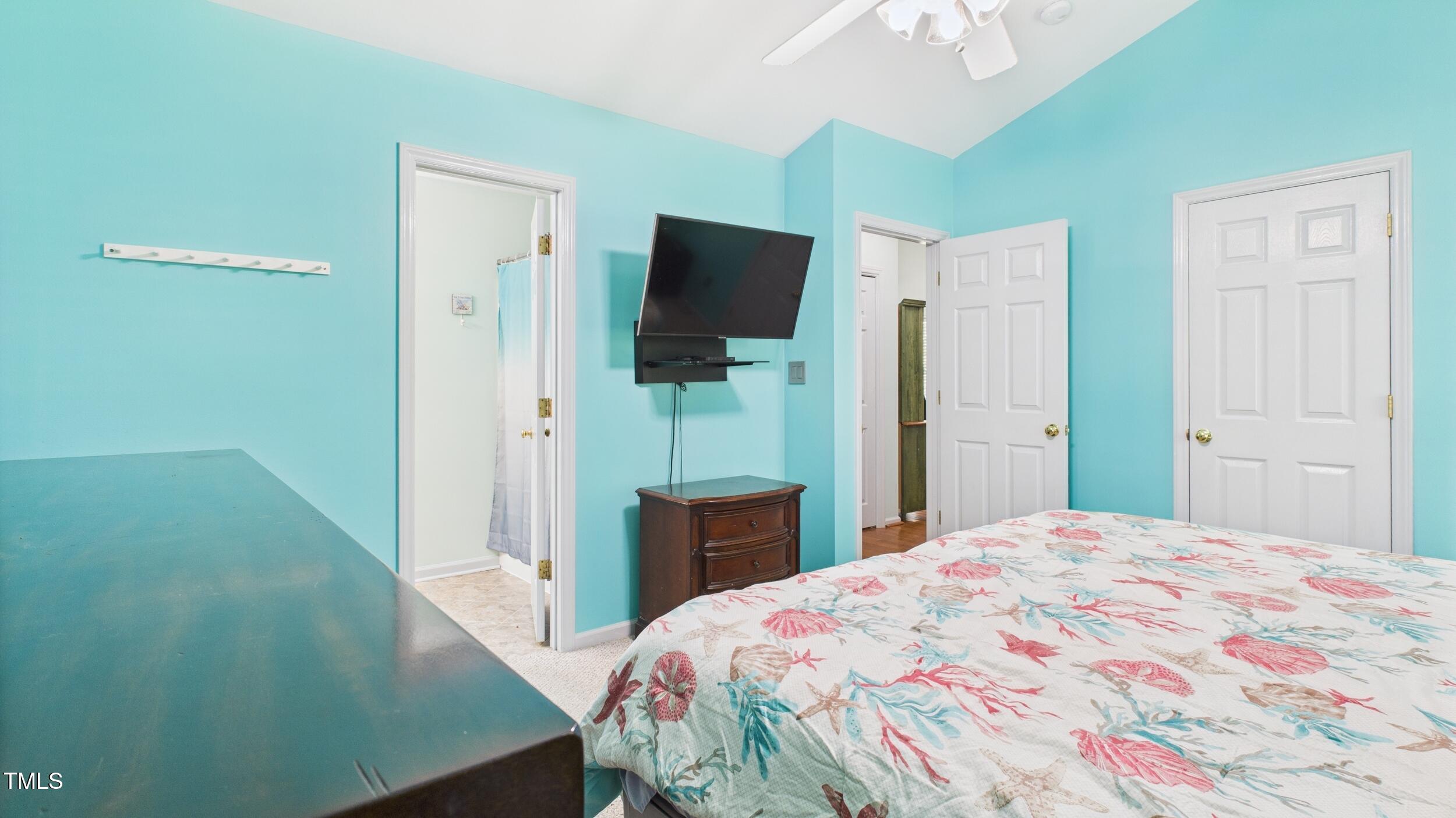 5309 Meadow Field Drive Mebane, NC 27302 - Photo 19 of 41 a bedroom with a bed and a flat screen tv