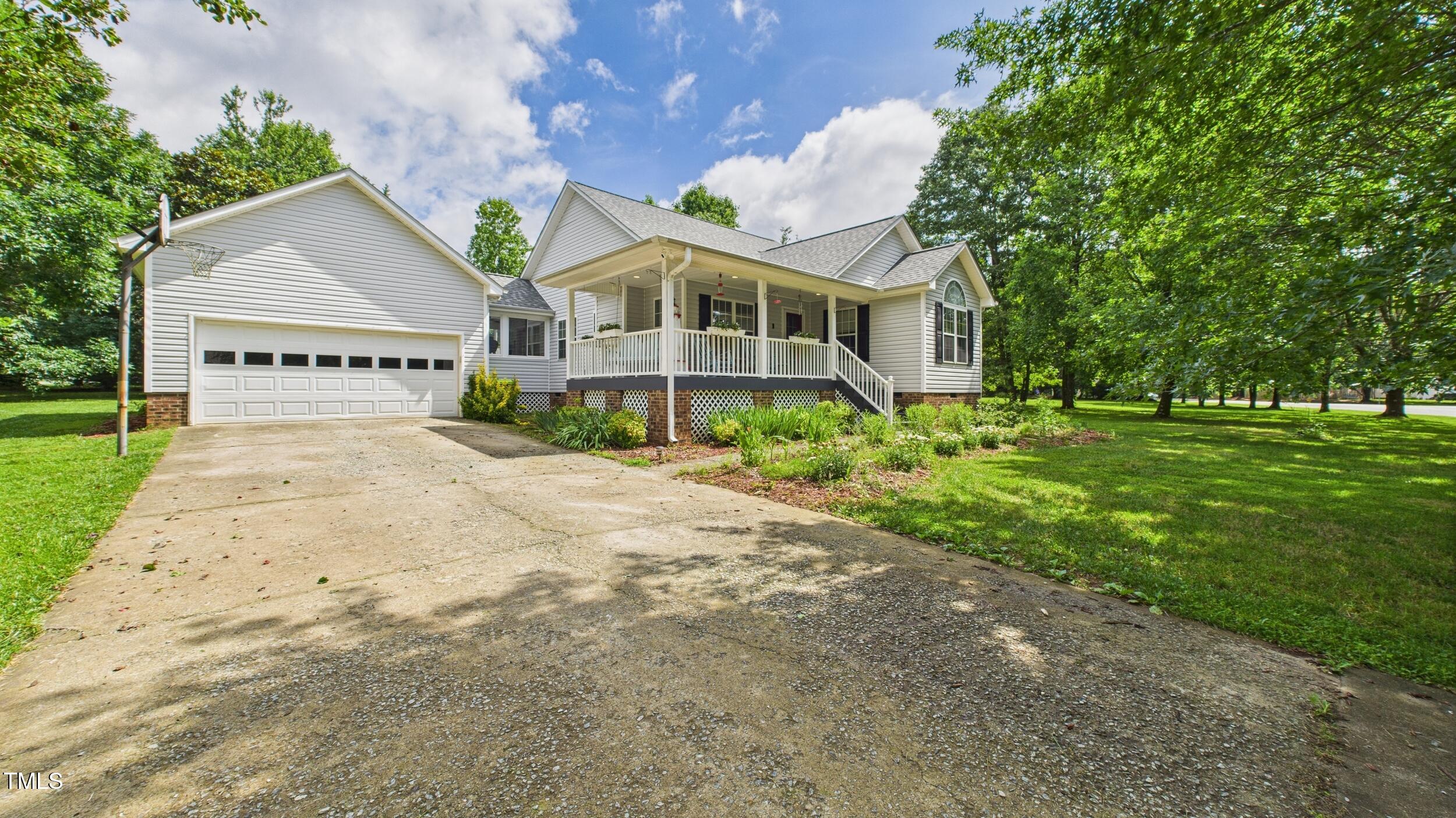 5309 Meadow Field Drive Mebane, NC 27302 - Photo 2 of 41 a front view of a house with a garden