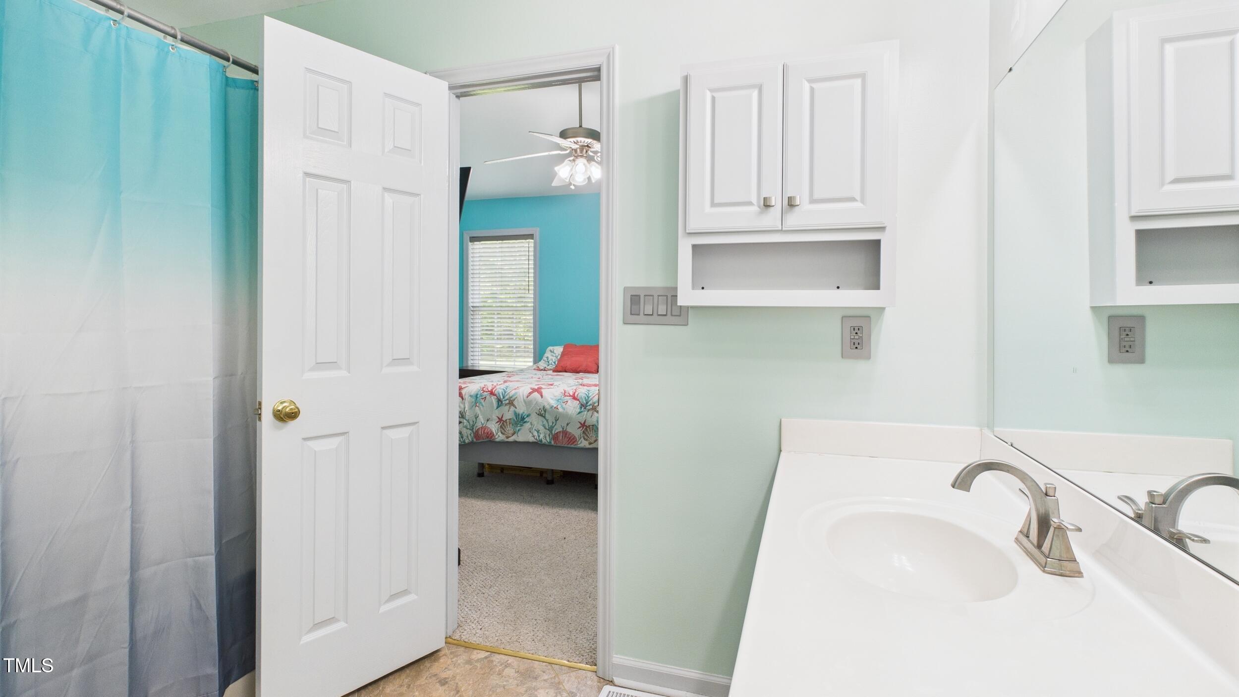 5309 Meadow Field Drive Mebane, NC 27302 - Photo 21 of 41 a bathroom with a sink and a tub