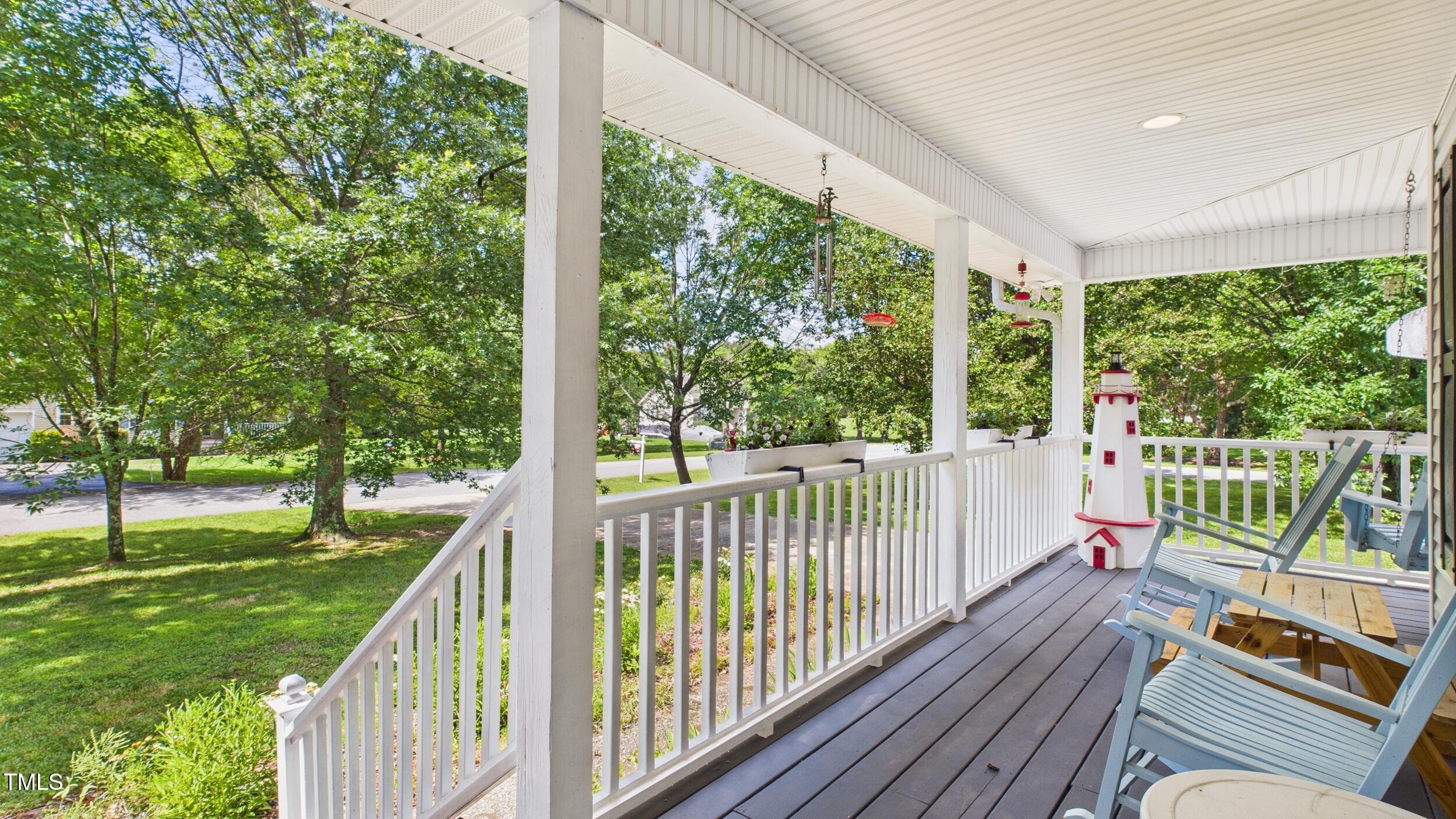 5309 Meadow Field Drive Mebane, NC 27302 - Photo 4 of 41 a view of a balcony with floor to ceiling windows with wooden fence