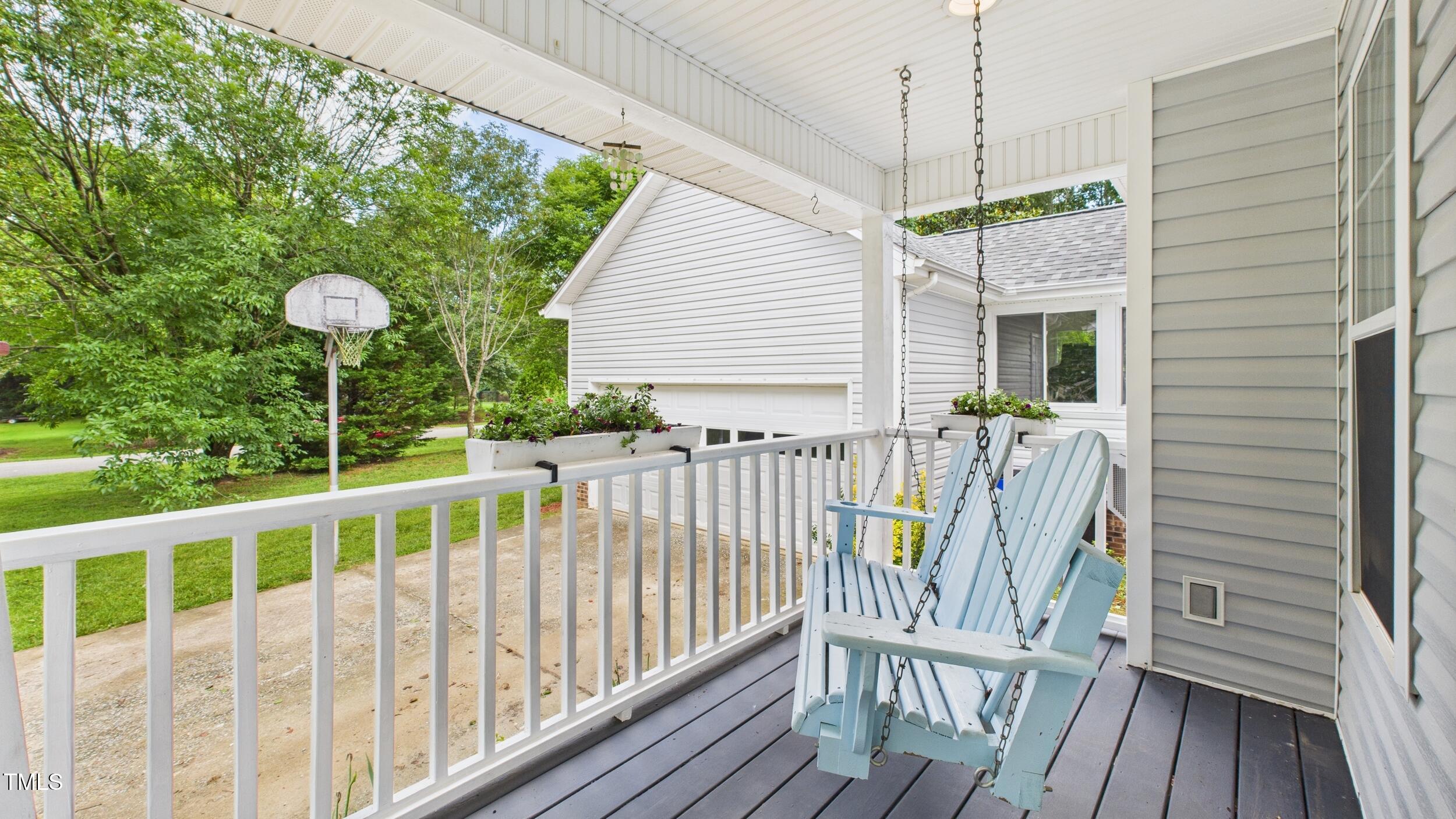 5309 Meadow Field Drive Mebane, NC 27302 - Photo 5 of 41 a view of a chair and tables in the balcony