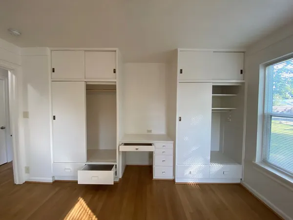 a view of kitchen with wooden floor and electronic appliances