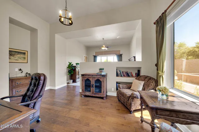 a bed sitting in a room next to a window