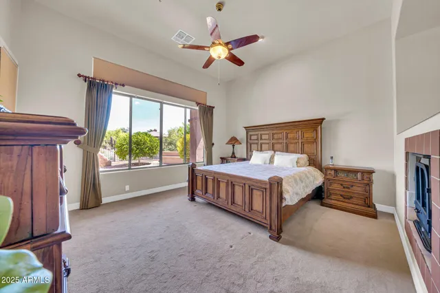 a bed room with a bed and a chair