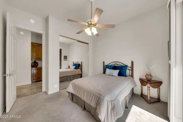 a bathroom with a sink mirror and a shower