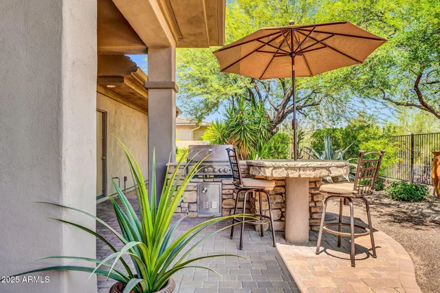 a view of a backyard with sitting area