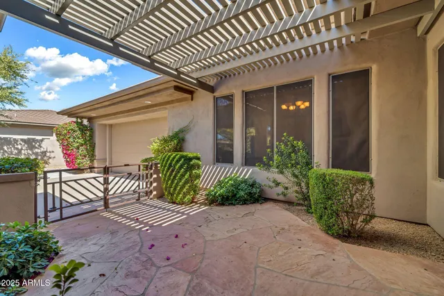 a view of a patio with couches chairs and a potted plant