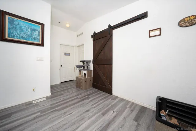a view of a livingroom with wooden floor