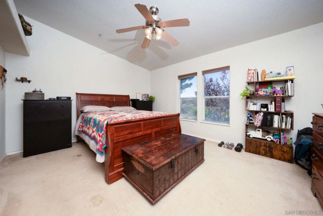 a bedroom with a bed and dresser