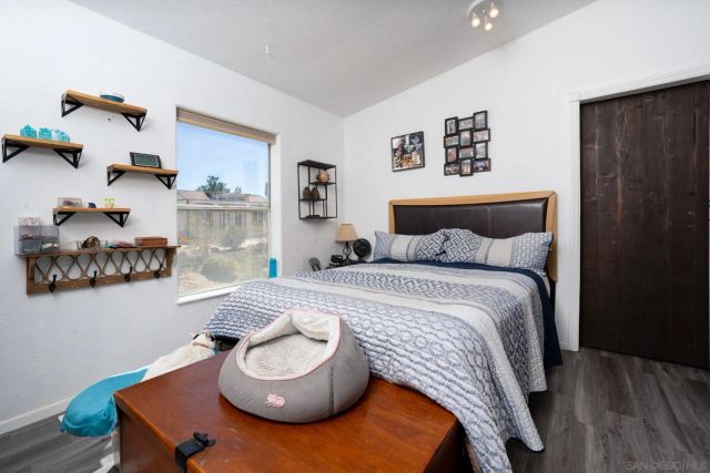 a bedroom with a bed and window