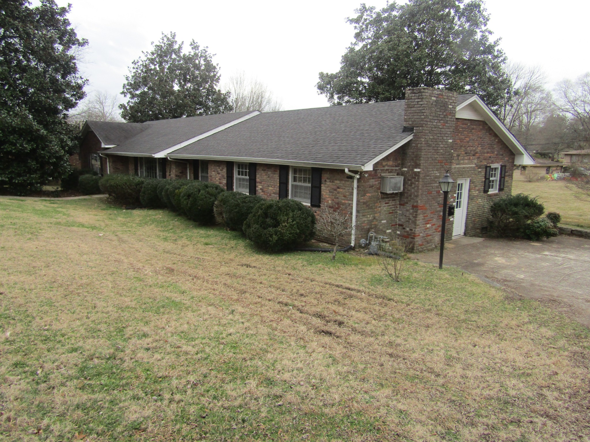 106 Sunset Drive Pulaski, TN 38478 - Photo 1 of 20 a front view of a house with a yard and garage