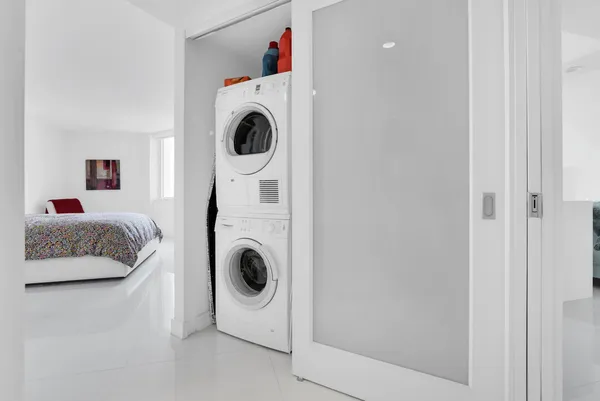 a utility room with dryer and washer
