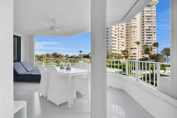 a view of balcony with furniture