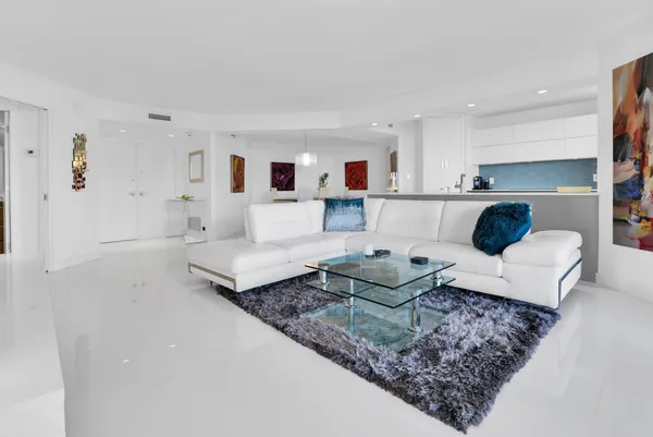 a living room with furniture and a rug