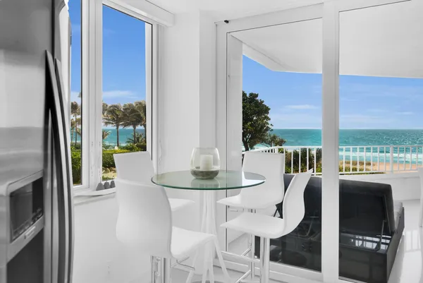 a view of a dining room with furniture window and outside view