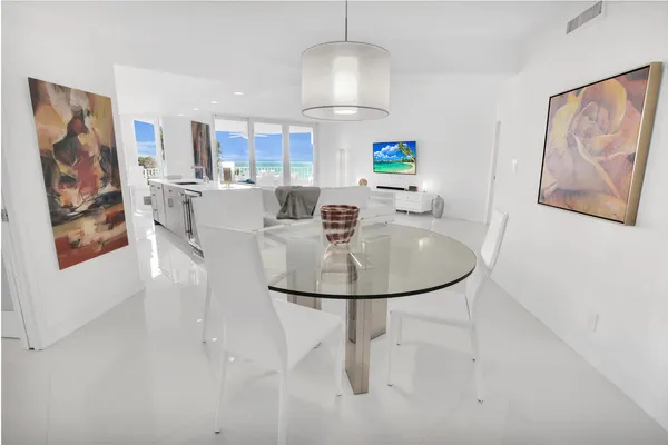 a dining room with furniture and window