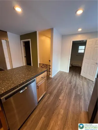 a view of kitchen and wooden floor