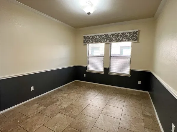 a view of an empty room and window