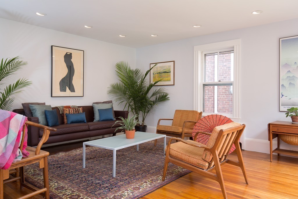 20 Maynard Place Cambridge, MA 02138 - Photo 3 of 10 a living room with furniture and a large window