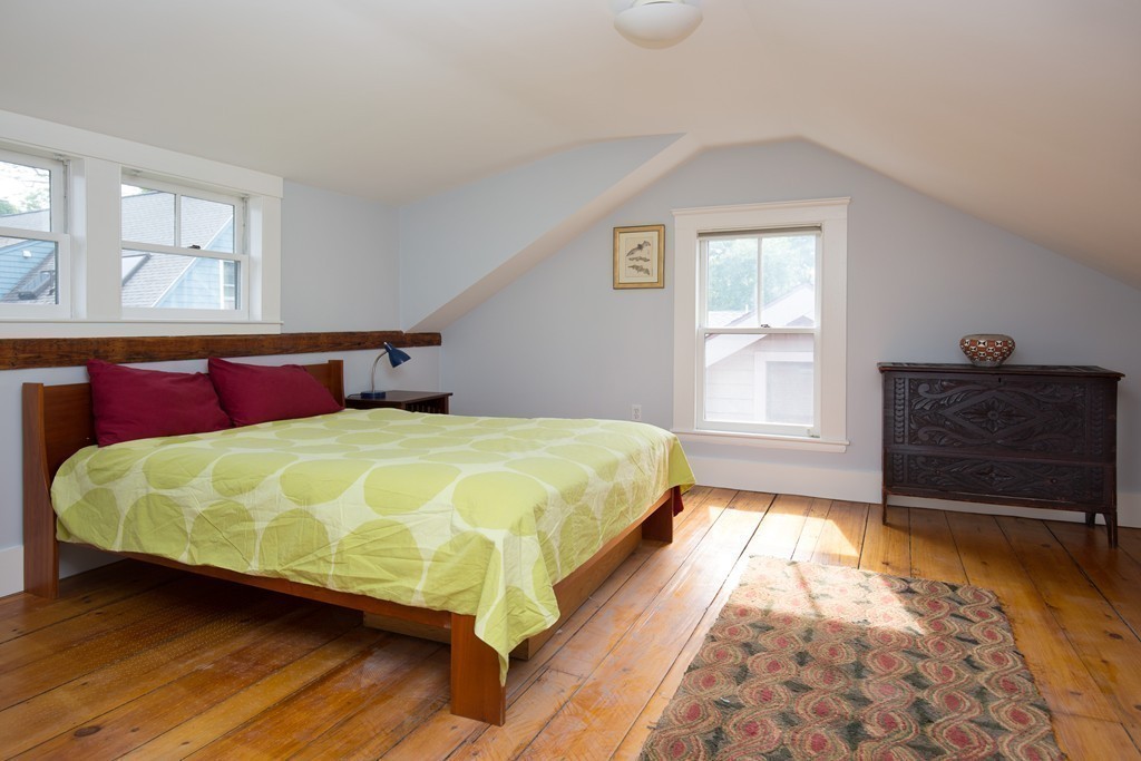 20 Maynard Place Cambridge, MA 02138 - Photo 9 of 10 a large bed sitting in a bedroom next to a window