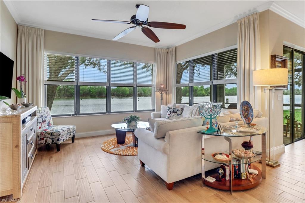 1296 Verde Drive, Unit 3 Naples, FL 34105 - Photo 7 of 31 a living room with furniture and a flat screen tv