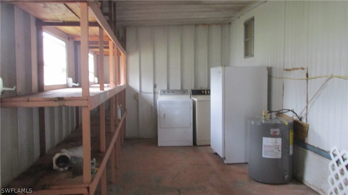 7301 Pinehurst Road Bokeelia, FL 33922 - Photo 11 of 11 a kitchen with refrigerator and window