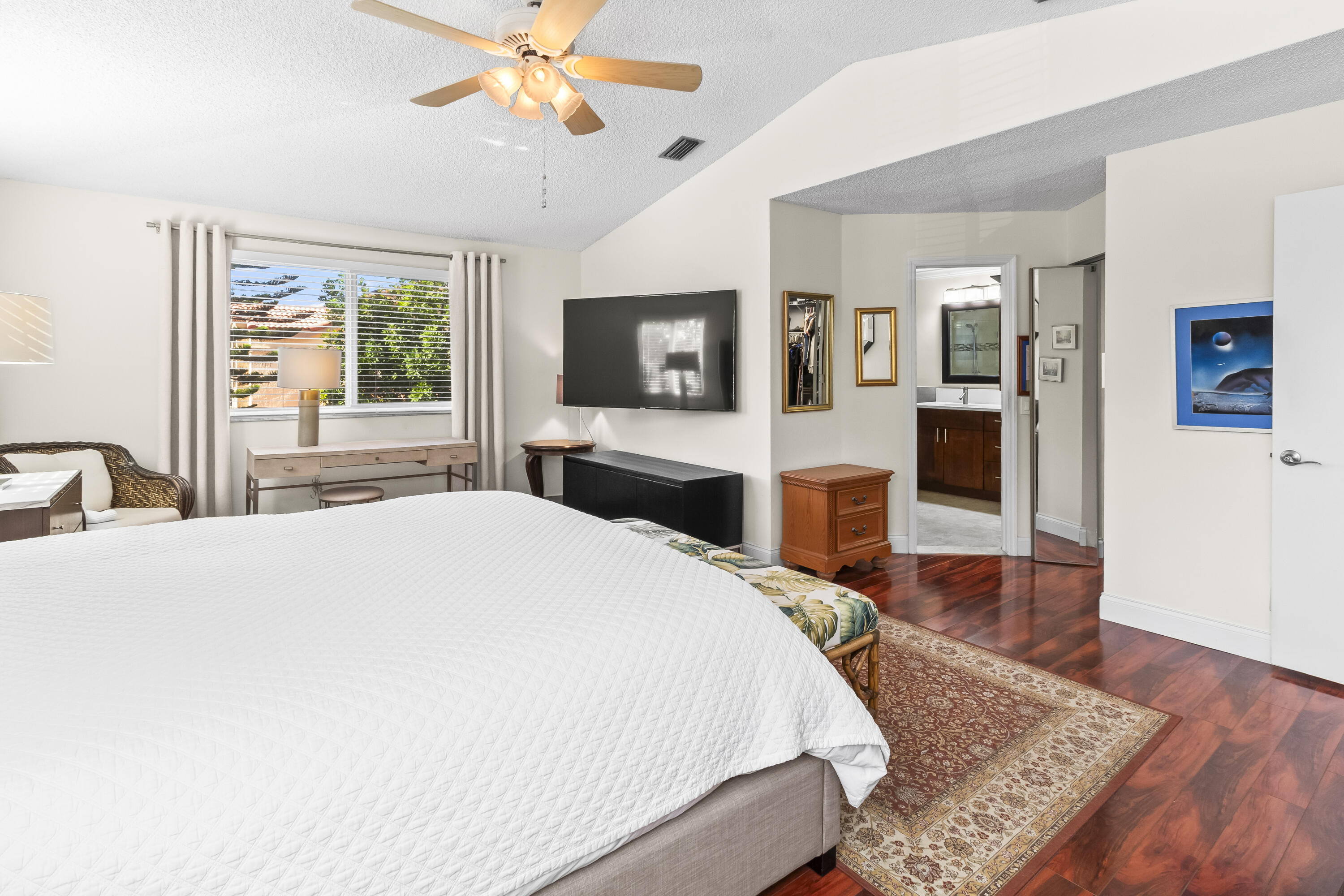 6700 Via Regina Boca Raton, FL 33433 - Photo 13 of 15 a bedroom with a bed and a flat screen tv