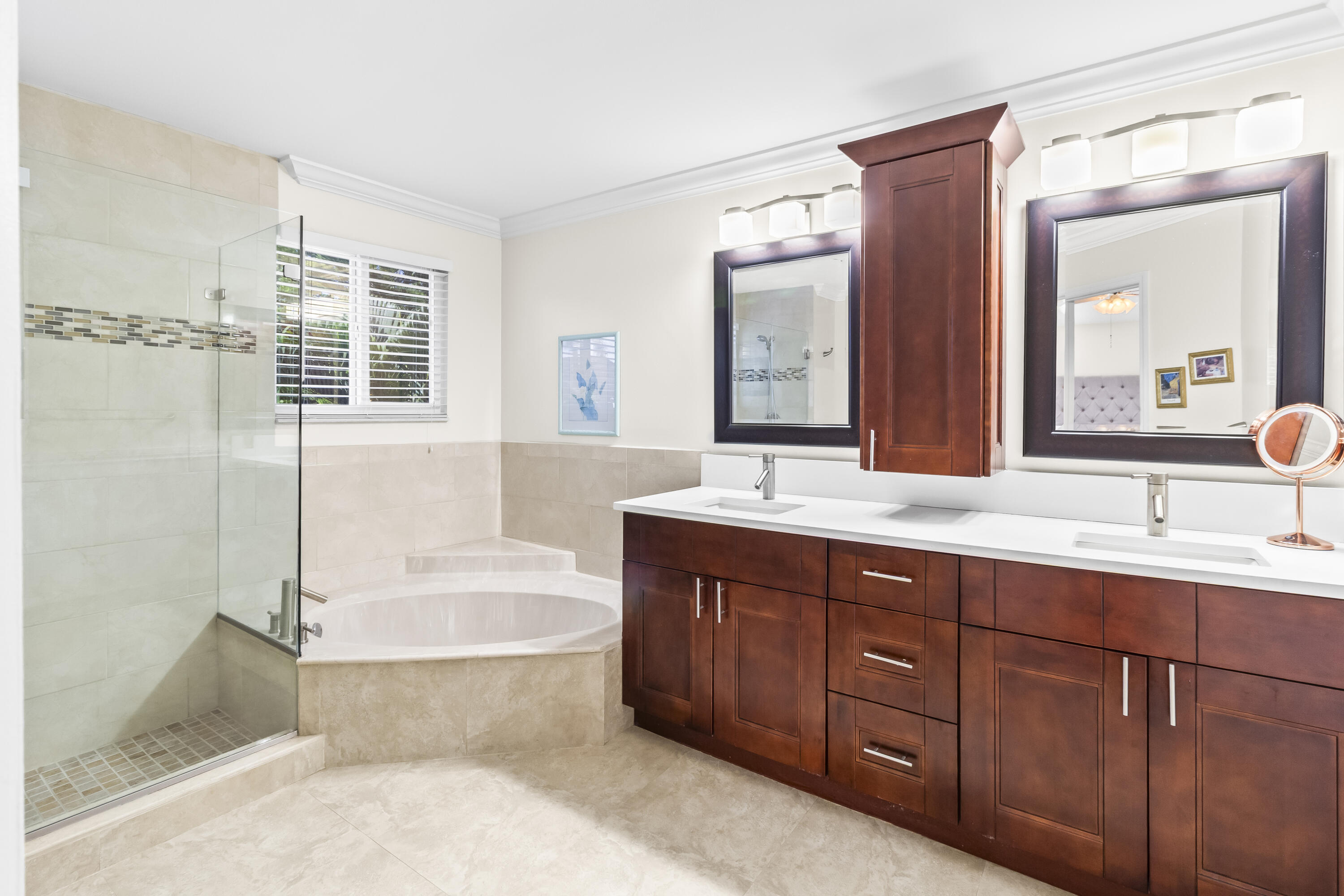 6700 Via Regina Boca Raton, FL 33433 - Photo 14 of 15 a bathroom with a bathtub sink double vanity and mirror