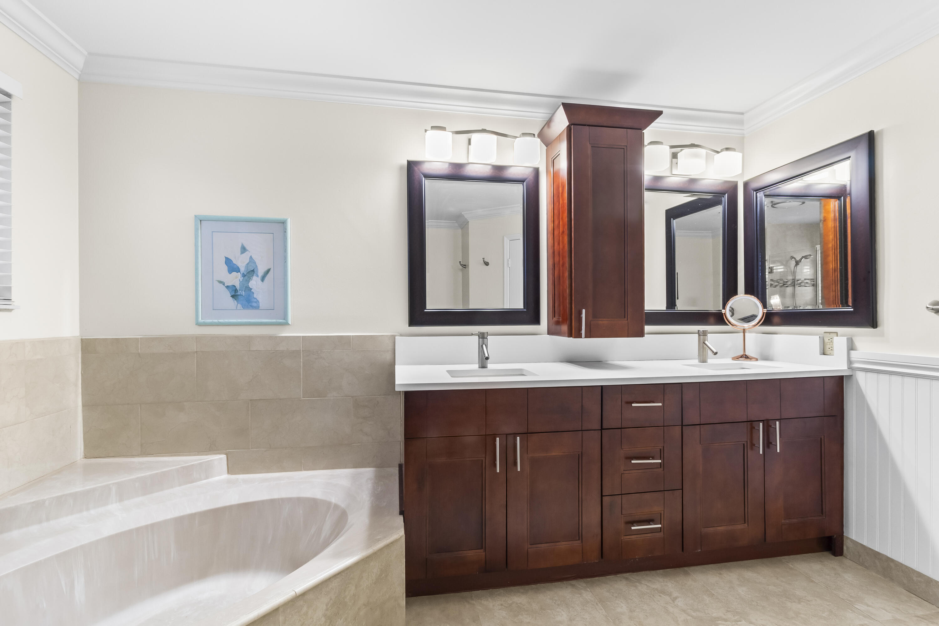 6700 Via Regina Boca Raton, FL 33433 - Photo 15 of 15 a bathroom with a tub a double vanity sink and mirror