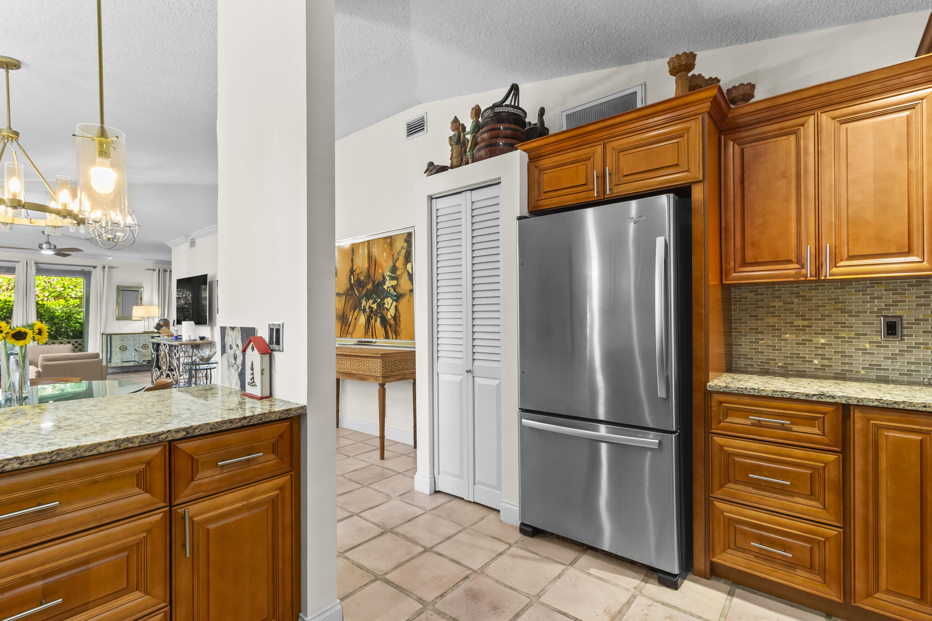 6700 Via Regina Boca Raton, FL 33433 - Photo 4 of 15 a kitchen with stainless steel appliances granite countertop a refrigerator and a sink