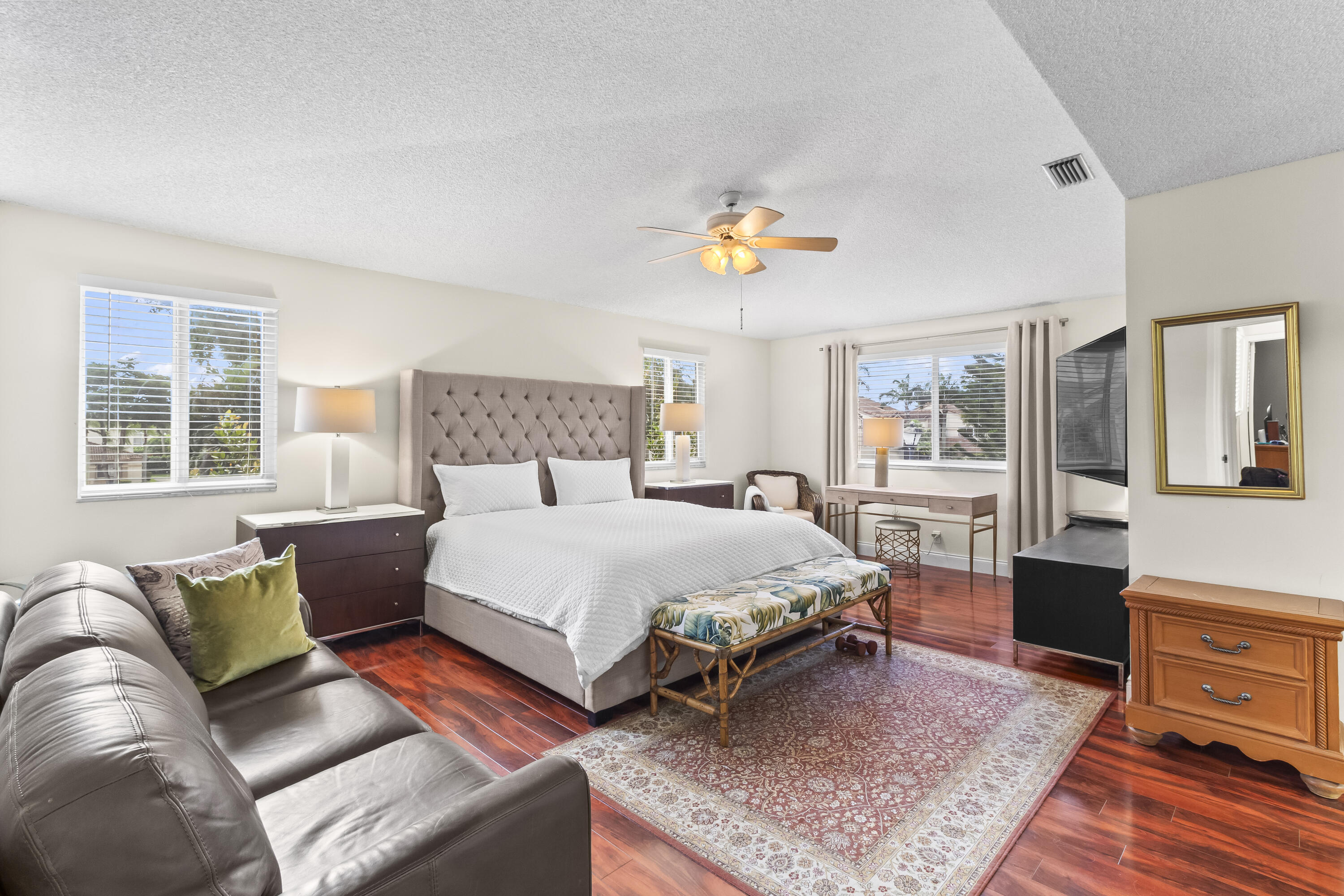 6700 Via Regina Boca Raton, FL 33433 - Photo 10 of 15 a bedroom with a bed a couch and dresser