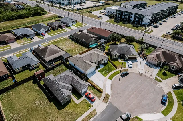 an aerial view of a house with a ocean view