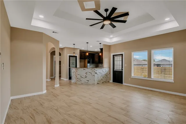 a view of a bathroom with a sink and mirror