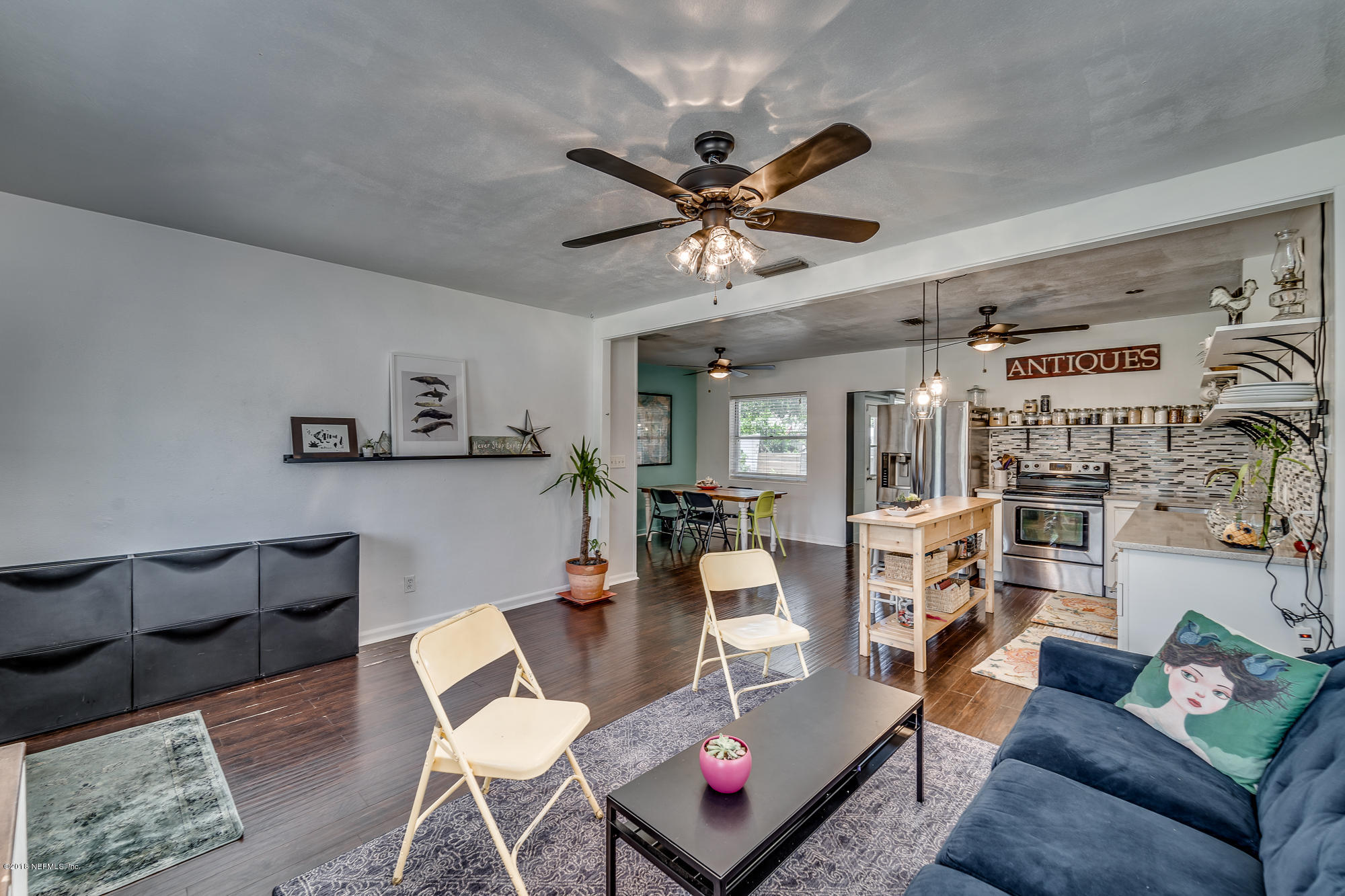 6124 Colgate Road Jacksonville, FL 32217 - Photo 17 of 26 a living room with furniture and a view of kitchen